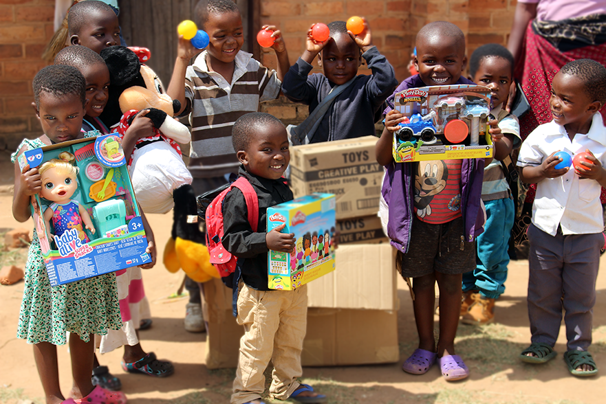 Children at Tepatepa CBCC carrying Toys